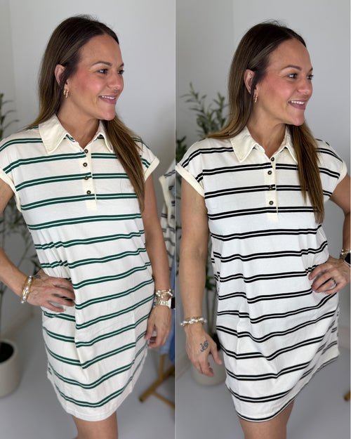 Woman wearing a white and green striped dress, smiling and posing indoors.