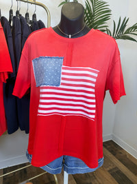 Red vintage wash t-shirt with American flag design on a mannequin